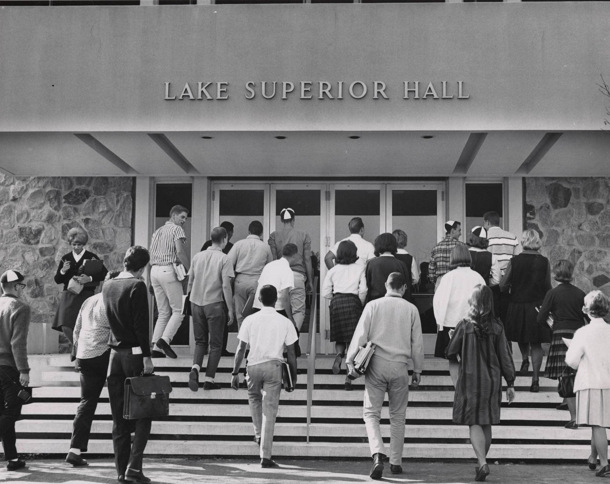 Students walking up the steps of Lake Superior Hall.